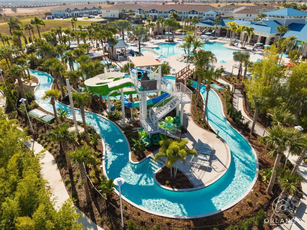 Windsor Hills Rest Day Guide Near Disney, showing an aerial view of the resort with pools, slides, and lush greenery ideal for relaxing between theme park days