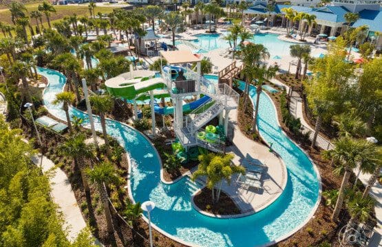 Windsor Hills Rest Day Guide Near Disney, showing an aerial view of the resort with pools, slides, and lush greenery ideal for relaxing between theme park days