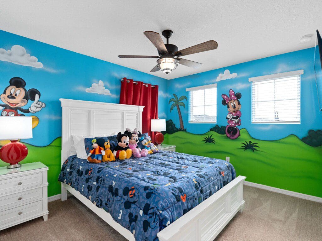 A cozy Mickey Mouse-themed bedroom offering a fun family stay close to the Top Things to Do Near Windsor Island