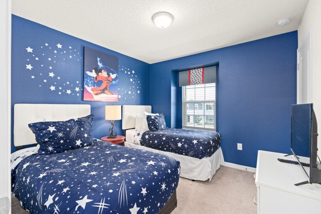 Disney-themed bedroom with Mickey Mouse frame in the best area to stay near Disney World