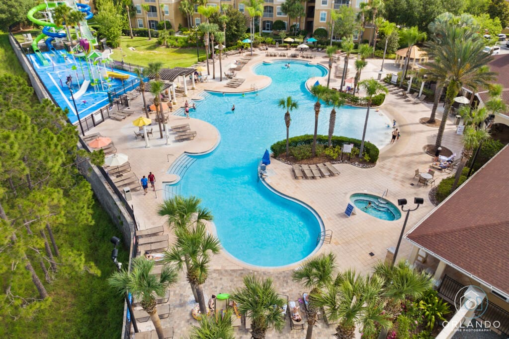 Is Windsor Hills Worth It? A top view of Windsor Hills Resort with pools, slides, and guests enjoying a sunny day near Disney