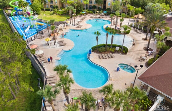 Is Windsor Hills Worth It? A top view of Windsor Hills Resort with pools, slides, and guests enjoying a sunny day near Disney