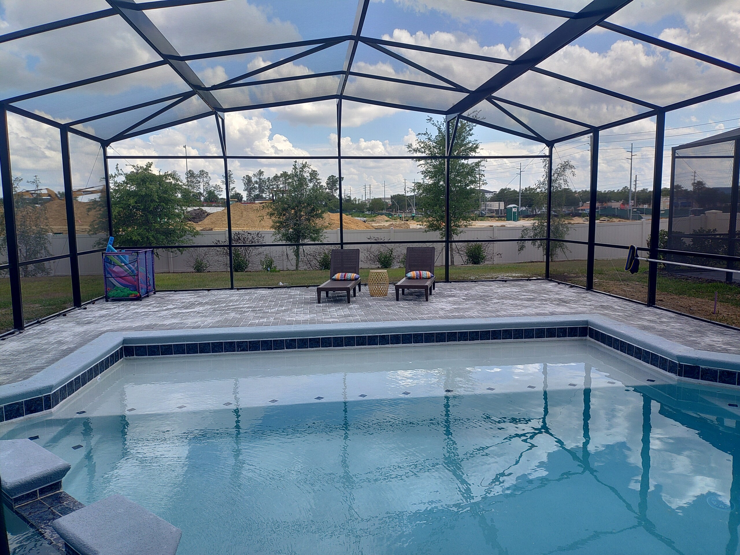 Huge pool with sun shelf. Furniture coming soon!